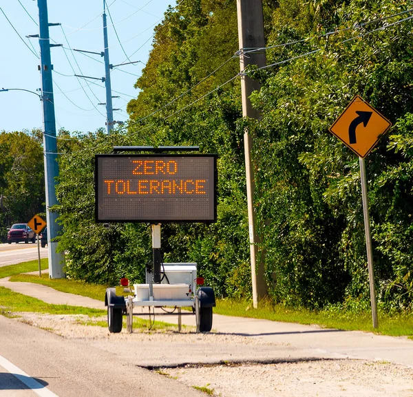Zero Tolerance written on a solar powered mobile road sign