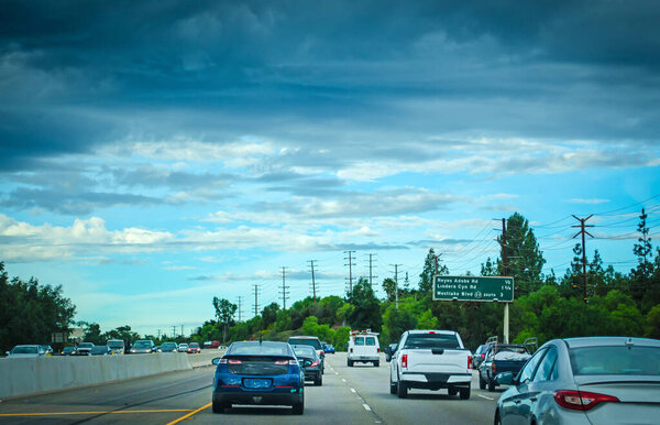 Traffic in a freeway on a cloudy day in California, USA