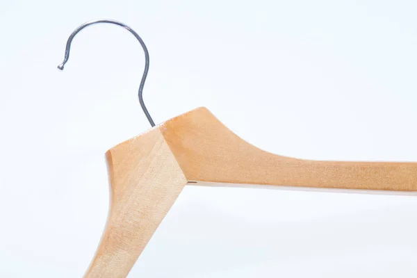 Wooden coat hanger, clothes hanger on a white background isometric view
