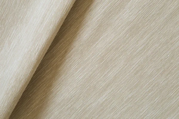 Beige color fabric fold background