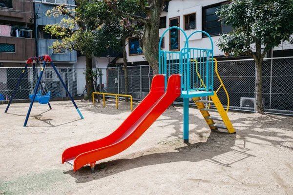 Slide and swings on playground in Osaka, Japan