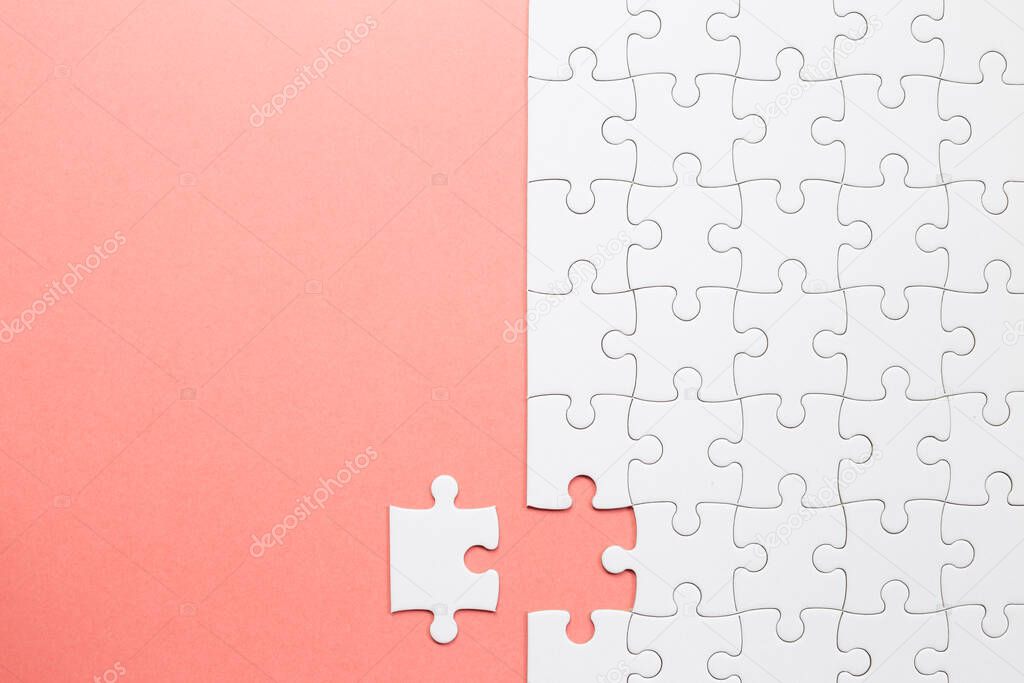 Set of white puzzle pieces and last one piece