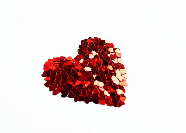 Red heart made up of small hearts on an isolated white background for Valentine's Day or wedding