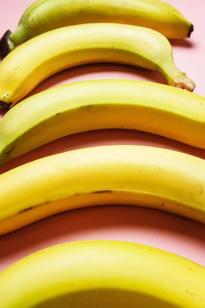 bananas on a pink background. Fashion photo of bananas on the background, beautiful pattern