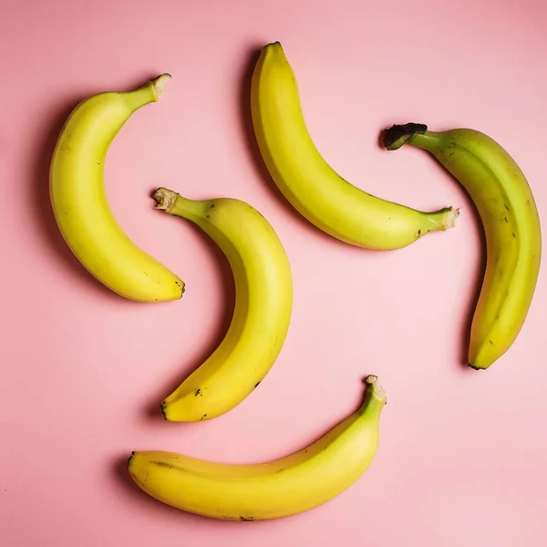 bananas on a pink background. Fashion photo of bananas on the background, beautiful pattern