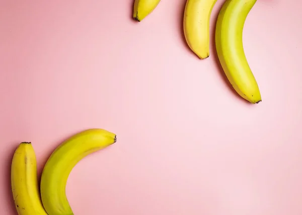 bananas on a pink background. Fashion photo of bananas on the background, beautiful pattern