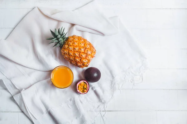 Pineapple and passion fruit juice In the White table background