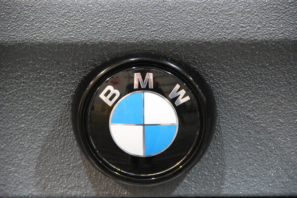 Kyiv / Ukraine. 28 September 2018:BMW car icon on gray background. Symbol manufacturer of cars BMW. White and blue sign of German brand auto BMW