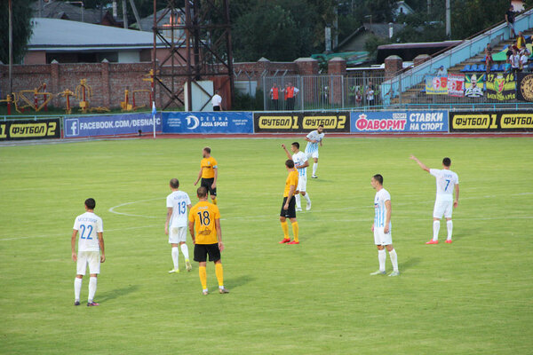 Chernihiv / Ukraine. 05 August 2018:Football teams Desna Chernihiv and Alexandria play football match. Photo of game moment during football match. Corner while football game. Soccer players fighting for ball