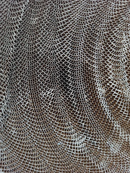 Oluklu kağıt. Eski kıvrımlı kağıdın dokusu. Eski kağıt dokusu. Tasarım ve iç dekorasyon için malzeme. Eski ambalaj malzemelerinin dokusu. Desenli arkaplan