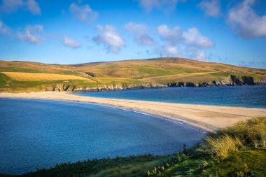 Scotland, Shetland Islands, St Ninian's Beach, A tombolo is a deposition landform in which an island is attached to the mainland by a narrow piece of land such as a spit or bar.  clipart