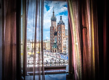 Cracow (Krakow) - Main Square (Rynek Glowny) with Marketplace (Sukiennice), Adam Mickiewicz Monument (pomnik Adama Mickiewicza), church of Saint Mary (Kosciol Mariacki) and church of Saint Adalbert (Kosciol sw. Wojciecha) - window view clipart