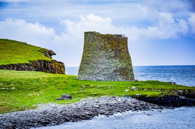 Mousa Broch is the finest preserved example of an Iron Age broch or round tower. It is in the small island of Mousa in Shetland, Scotland. It is the tallest broch still standing and amongst the best-preserved prehistoric buildings in Europe. clipart