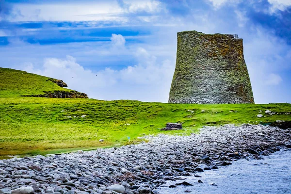 Mousa Broch is the finest preserved example of an Iron Age broch or round tower. It is in the small island of Mousa in Shetland, Scotland. It is the tallest broch still standing and amongst the best-preserved prehistoric buildings in Europe.