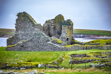 Scotland, Shetland Islands, Jarlshof is the best known prehistoric archaeological site in Shetland, Scotland. It lies near the southern tip of the Shetland Mainland and has been described as one of the most remarkable archaeological sites ever excava clipart