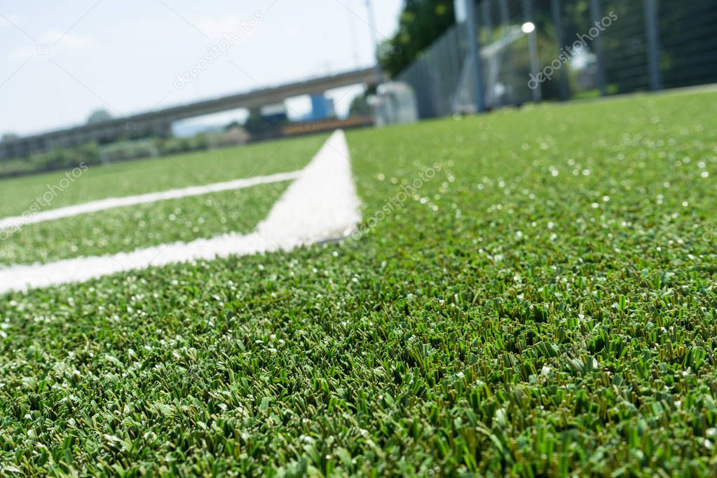 corner lines of football soccer field on plastic green