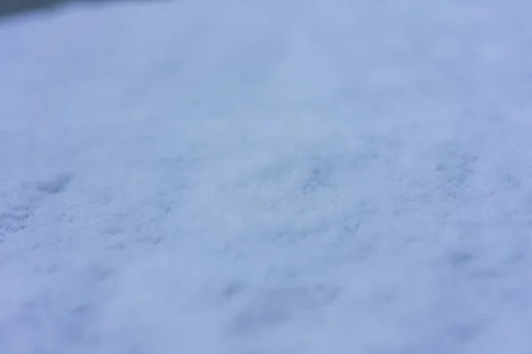 Nieve en un día gris vista superior de cerca — Foto de Stock