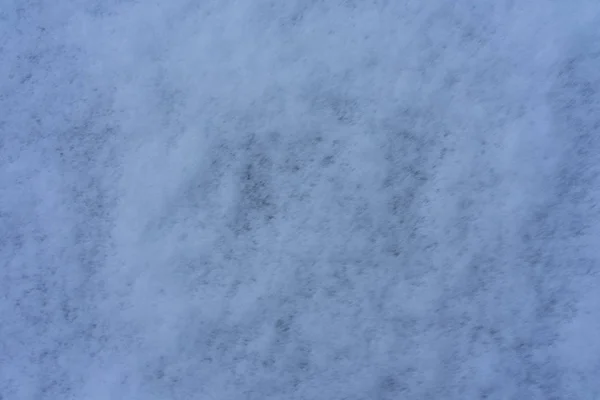 Sneeuw op een grijze dag bovenaanzicht close-up — Stockfoto