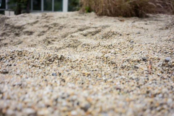 Duna de arena vista de cerca con pequeñas piedras textura — Foto de Stock