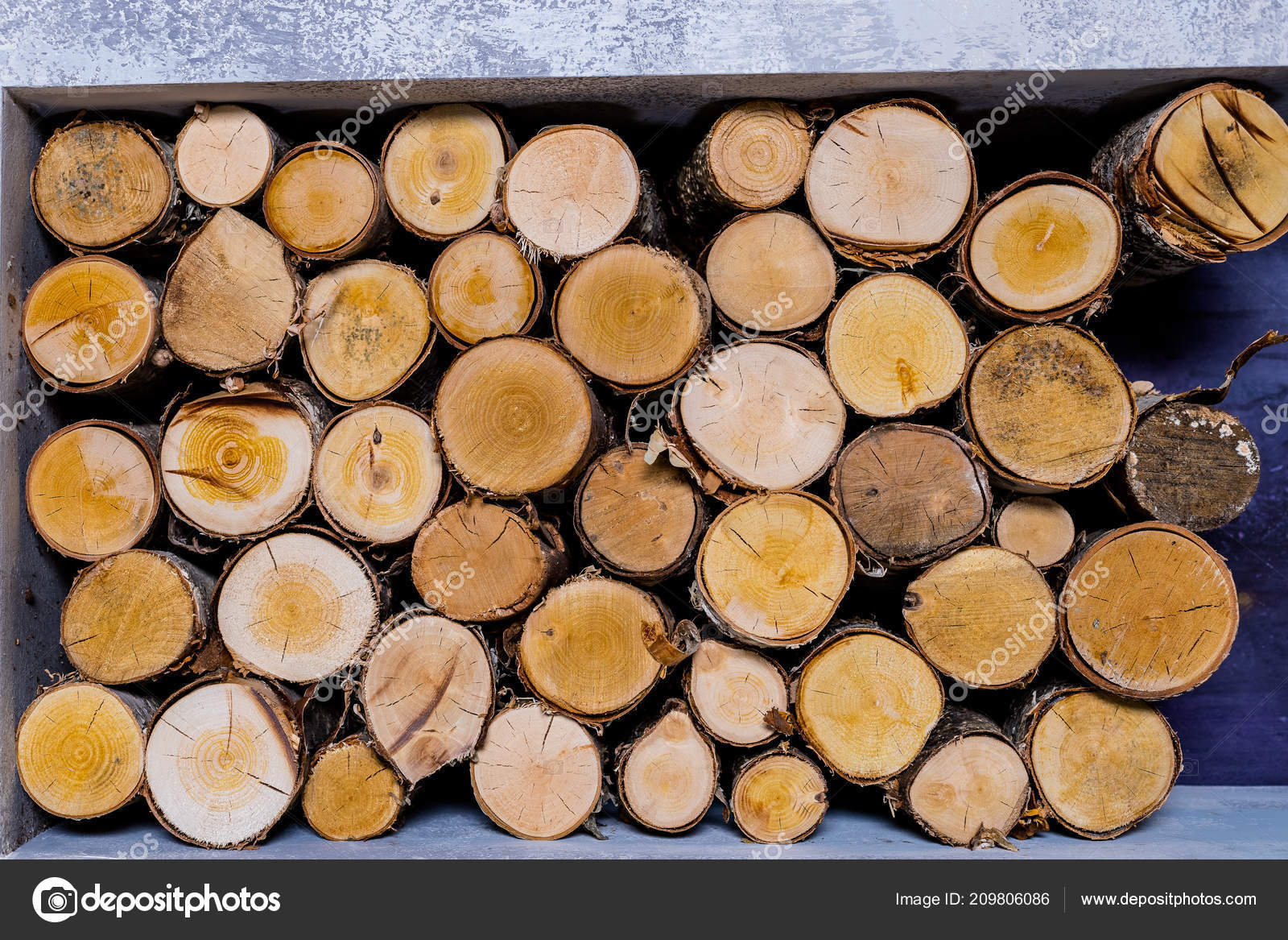Background Of Dry Chopped Firewood Logs Stacked Up On Top Of Each