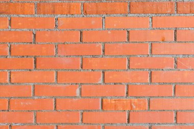 Flaman sedye Bond deseninde renkli turuncu tuğla duvar arka planı. Geniş tuğla duvar panoramik doku. Ev ve ofis tasarımı arka plan. mimari duvar kağıdı. Terracotta duvar