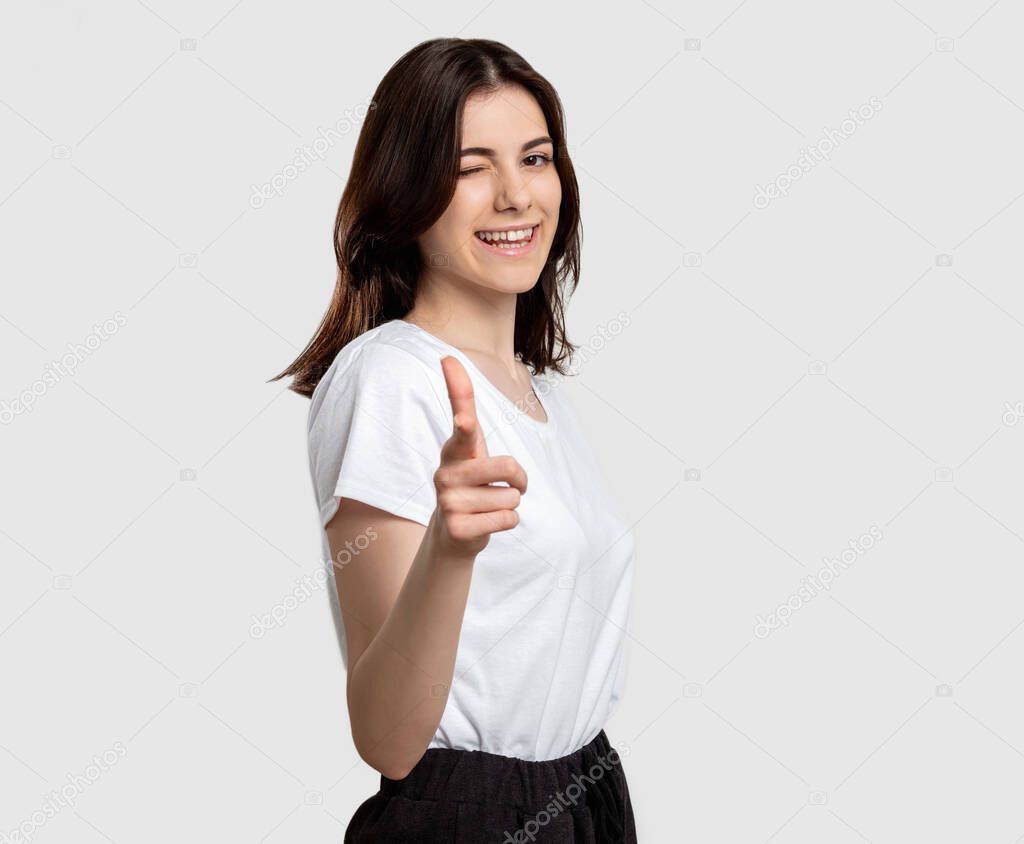 encouraging gesture woman pointing finger winking
