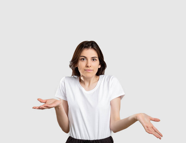 shrug gesture confused woman raising shoulders