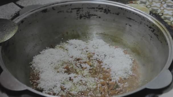 Cook Lays Rice Cauldron — Stock Video