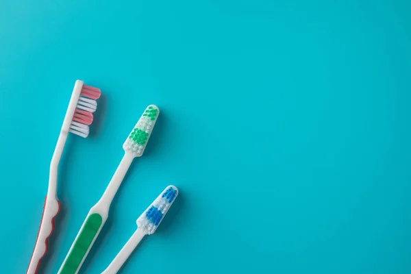 Toothbrushes on blue background — Stock Photo, Image