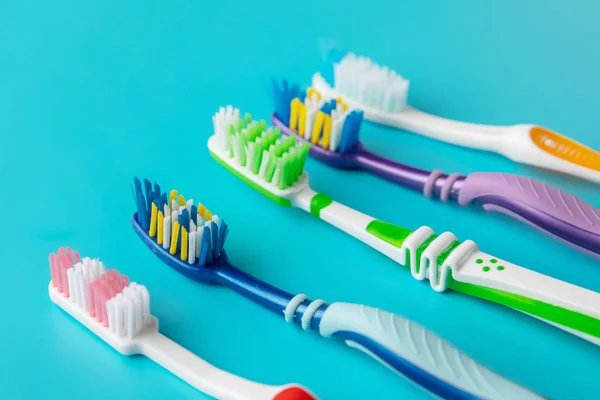 Toothbrushes in the form on a blue background — Stock Photo, Image