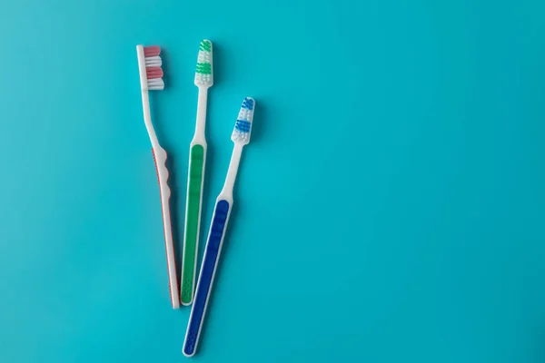 Toothbrushes on blue background — Stock Photo, Image
