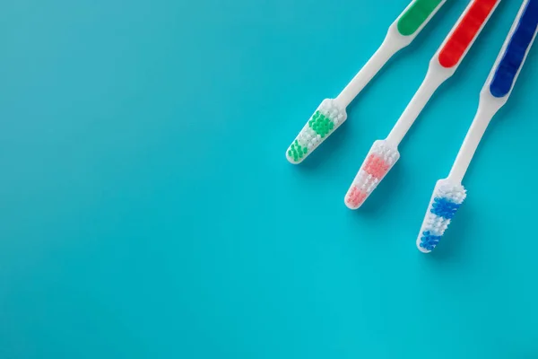 Family Toothbrushes Blue Background Space Text — Stock Photo, Image