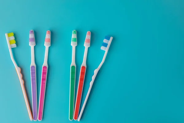 Toothbrushes Blue Background Six Shaped Pieces — Stock Photo, Image