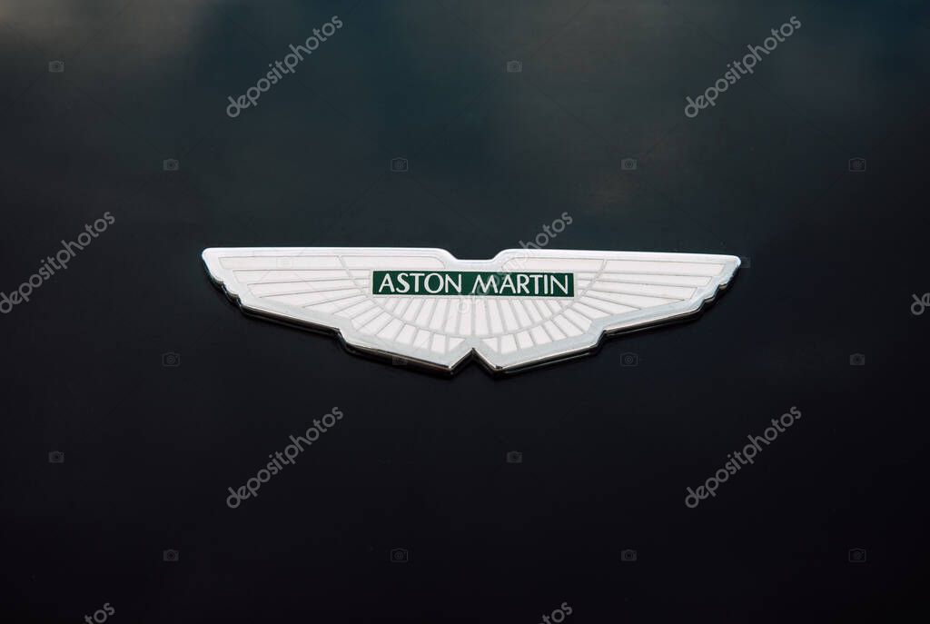 Vilnius, Lithuania - 2025-07-17 - Aston Martin emblem on the hood of a black luxury car