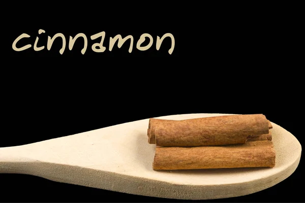 Cinnamon Sticks Wooden Spoon Isolated Black Background — Stock Photo, Image