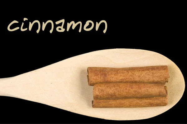 Cinnamon Sticks Wooden Spoon Isolated Black Background — Stock Photo, Image