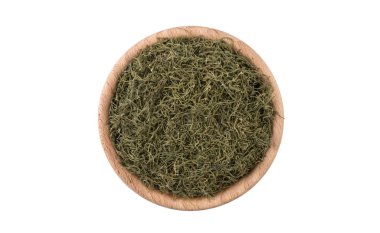 ahşap kase beyaz arka plan üzerinde izole dereotu. Baharat ve Gıda katkı maddeleri.