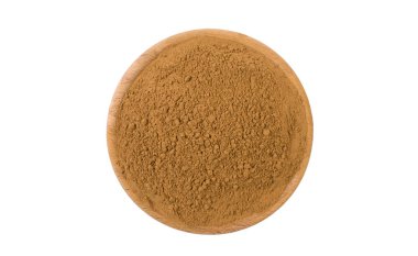 ahşap kase beyaz arka plan üzerinde izole zemin veya çentikli tarçın. Baharat ve Gıda katkı maddeleri.