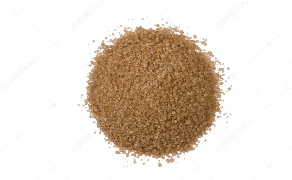 Brown or cane sugar heap isolated on white background. top view