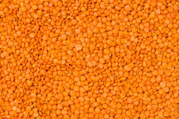red lentils texture background. nutrition. bio. natural food ingredient.