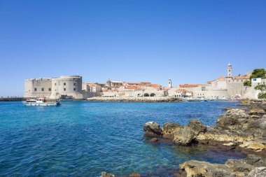 Dubrovnik Croatia Europe. Beautiful photo of old city ruin and Adriatic Sea in Dalmatia. Warm nice summer day. Lovely blue clear sky and ocean. Happy and joyful picture. Calm and relaxing outdoors. clipart