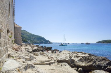 Dubrovnik Croatia Europe. Beautiful photo of old city ruin and Adriatic Sea in Dalmatia. Warm nice summer day. Lovely blue clear sky and ocean. Happy and joyful picture. Calm and relaxing outdoors. clipart