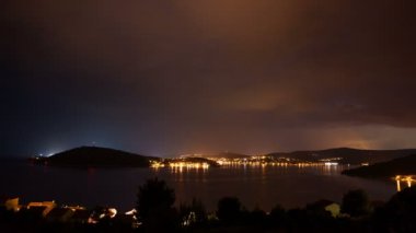 night view of the city of the island with stormy sky with lightning