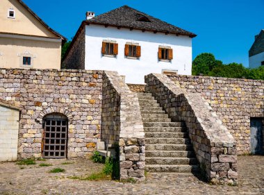 View on the stairs and traditional hungarian pise houses clipart