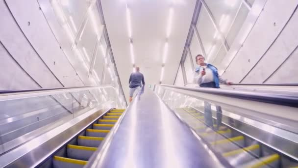 BUDAPEST, HUNGARY - AUGUST 31, 2018: View on the people using the escalator stairs of the underground railway metro in Budapest, Hungary. — Stock Video