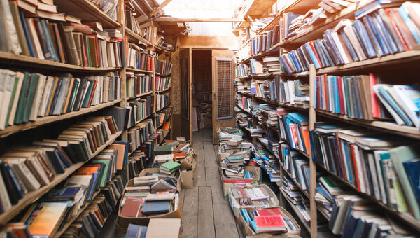 Atmospheric old library with books. Cozy Light Retro Library. Books Concept.