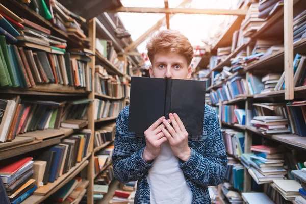 Young Man Amazed Eyes Stands Cozy Public Library Covers His — Stock Photo, Image