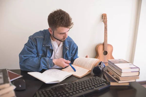 Student Sitting Home Computer Reads Books Performs Homework Assignment Handsome — Stock Photo, Image