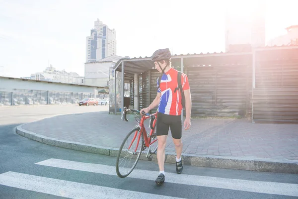 Professional Cyclist Sportswear Helmet Crosses Zebra Road Backdrop Sunlight Man — Stock Photo, Image