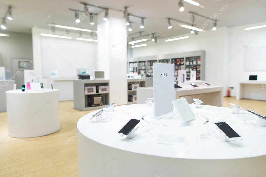 Showcase with smartphones in the background of technology store.